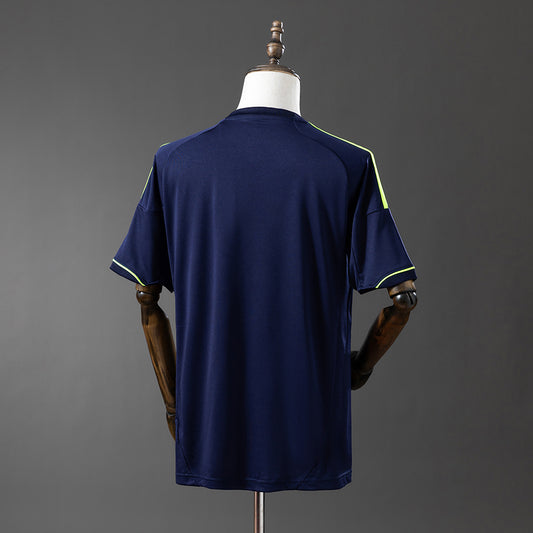 Camiseta retro Real Madrid 2012/13 segunda equipación lila detalle escudo – Cortita y al Pie