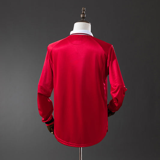 Camiseta retro Manchester United 1999/00 primera equipación manga larga detalle Treble – Cortita y al Pie