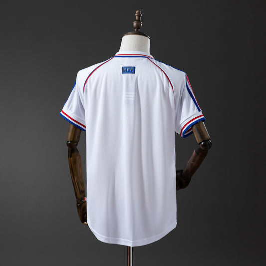 Camiseta retro Francia 1998 segunda equipación blanca detalle escudo – Cortita y al Pie