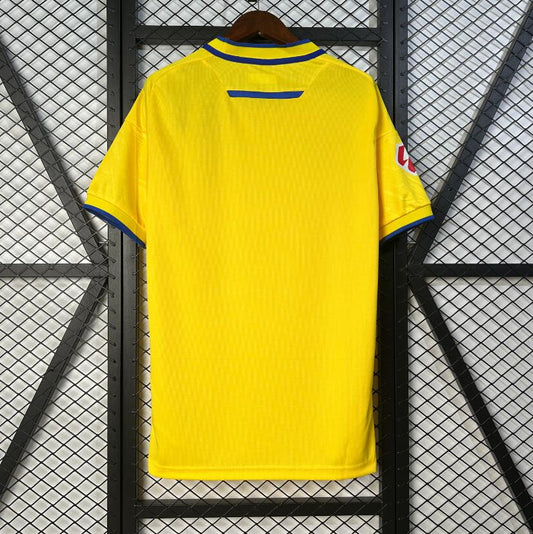Camiseta Cádiz 2025/26 primera equipación versión fan amarilla detalle escudo – Cortita y al Pie