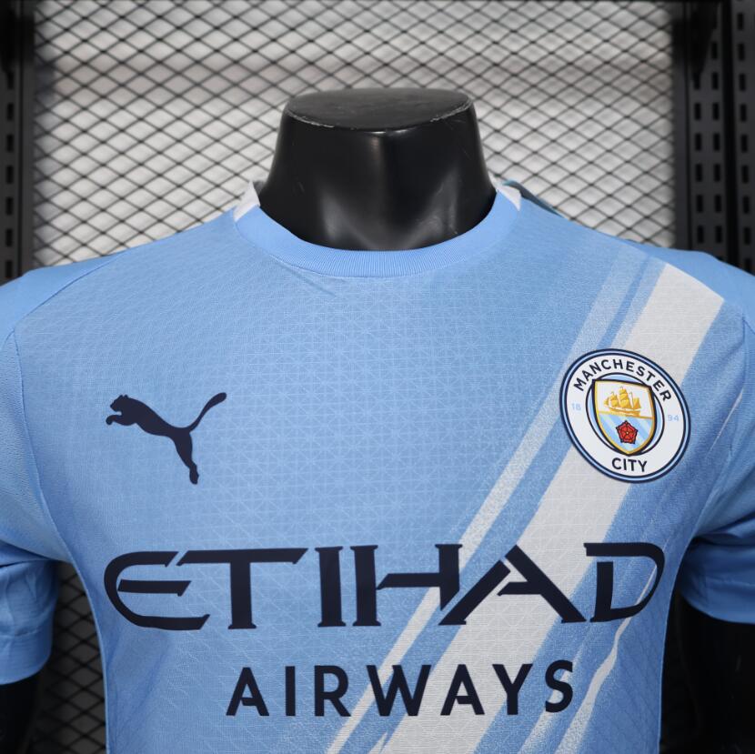 Camiseta Manchester City 2025/26 primera equipación versión jugador vista trasera – Cortita y al Pie