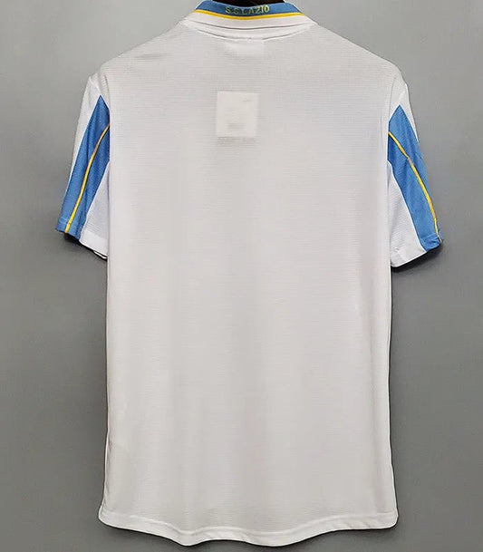 Camiseta retro Lazio 1998/99 primera equipación detalle escudo Olimpico – Cortita y al Pie