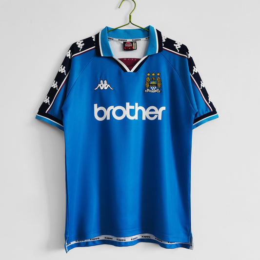 Camiseta retro Manchester City 1997/98 primera equipación celeste Anfield Etihad – Cortita y al Pie
