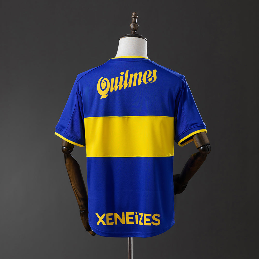 Camiseta retro Boca Juniors 1999/00 primera equipación detalle escudo Riquelme – Cortita y al Pie