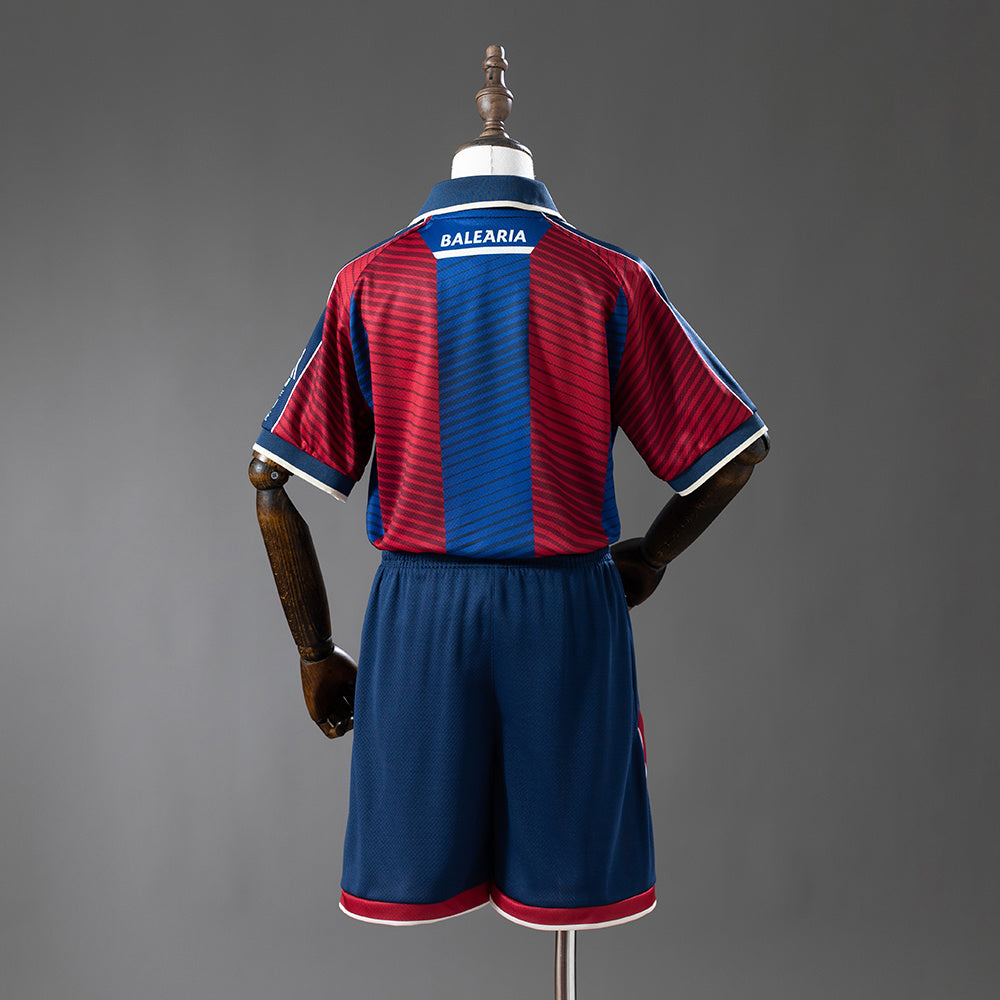 Camiseta Levante UD 2025/26 primera equipación versión niño detalle escudo – Cortita y al Pie