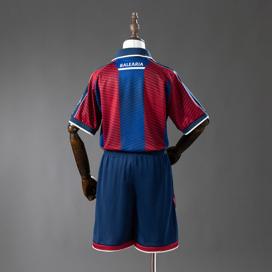 Camiseta Levante UD 2025/26 primera equipación versión niño detalle escudo – Cortita y al Pie