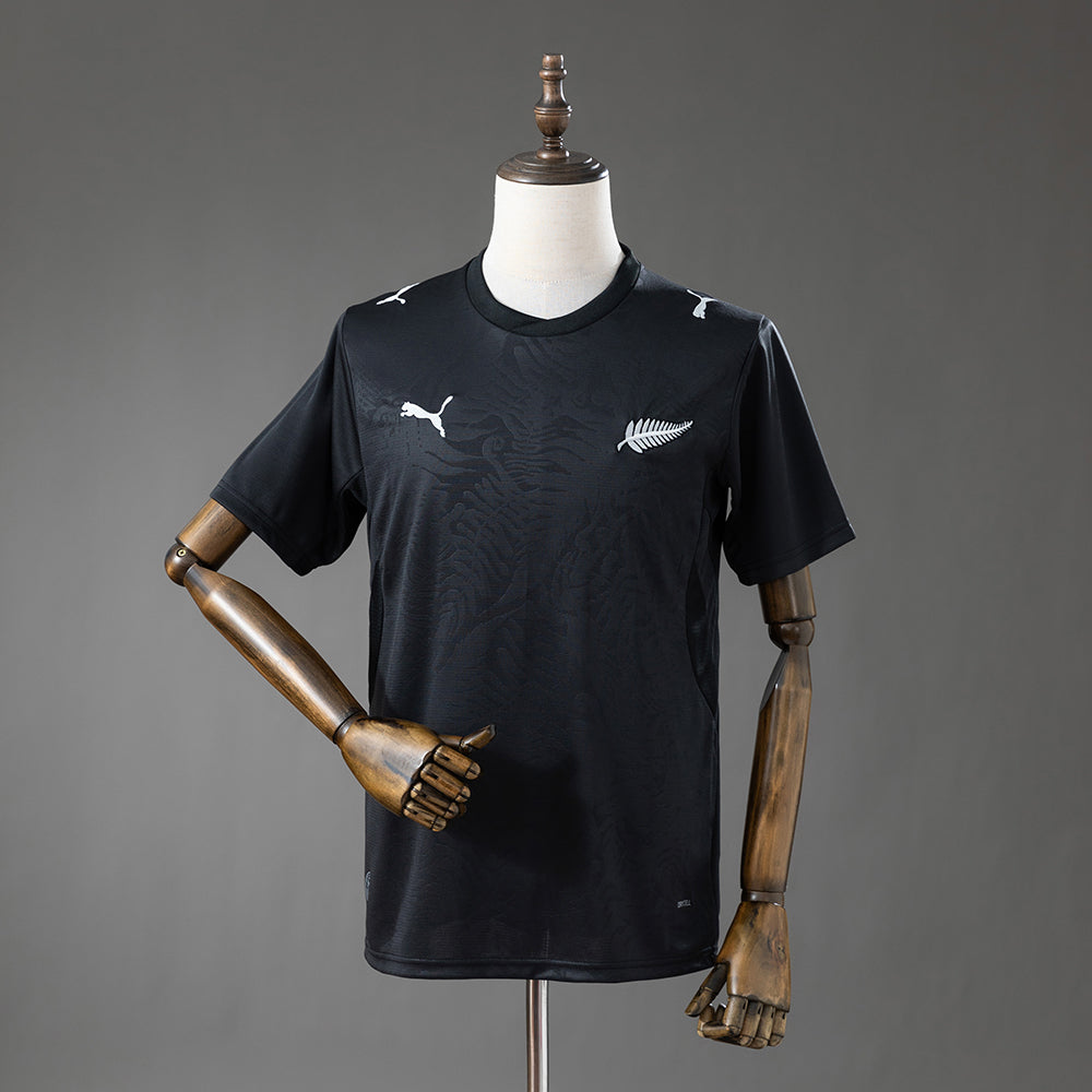 Camiseta Nueva Zelanda Mundial 2026 primera equipación versión fan blanca negra – Cortita y al Pie
