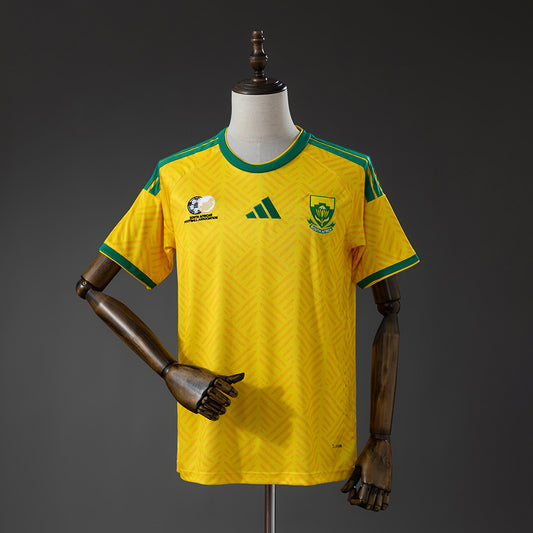 Camiseta Sudáfrica Mundial 2026 primera equipación versión fan verde amarilla – Cortita y al Pie