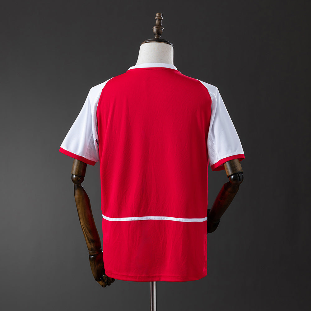 Camiseta retro Arsenal 2002/03 primera equipación detalle roja Highbury Wenger – Cortita y al Pie