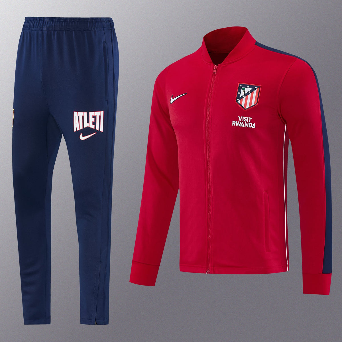 Chándal Atlético de Madrid 2026/27 Rojo chaqueta y pantalón - vista frontal con escudo