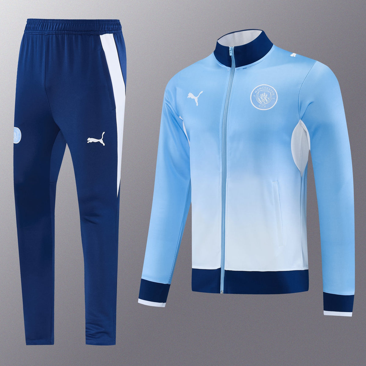 Chándal Manchester City 2026/27 Azul Cielo chaqueta y pantalón - vista frontal con escudo del City