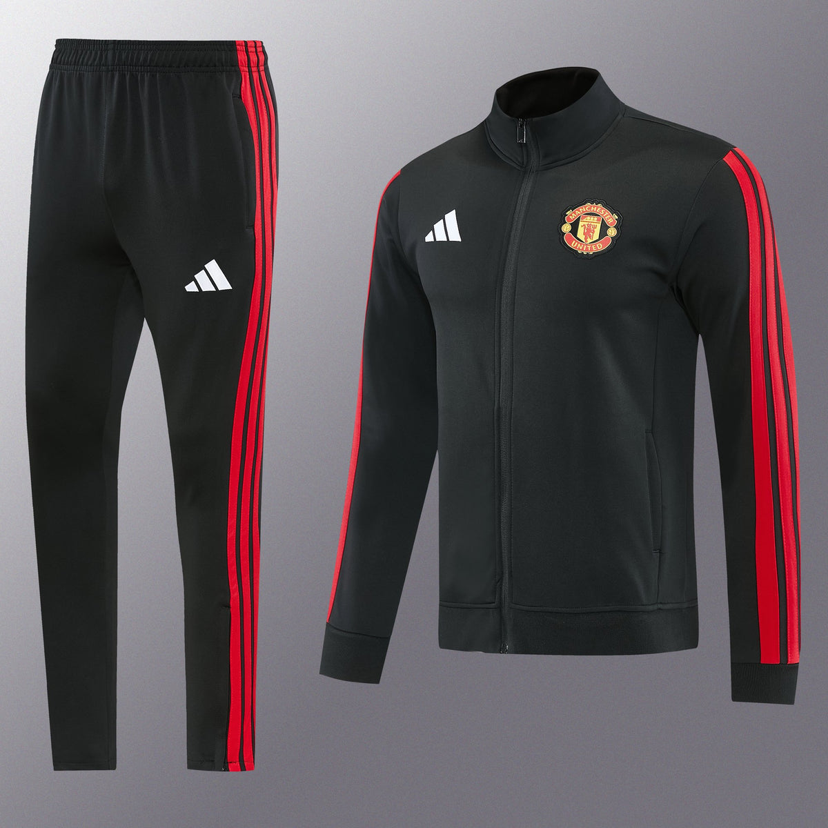 Chándal Manchester United 2026/27 Negro chaqueta y pantalón - vista frontal con escudo del United