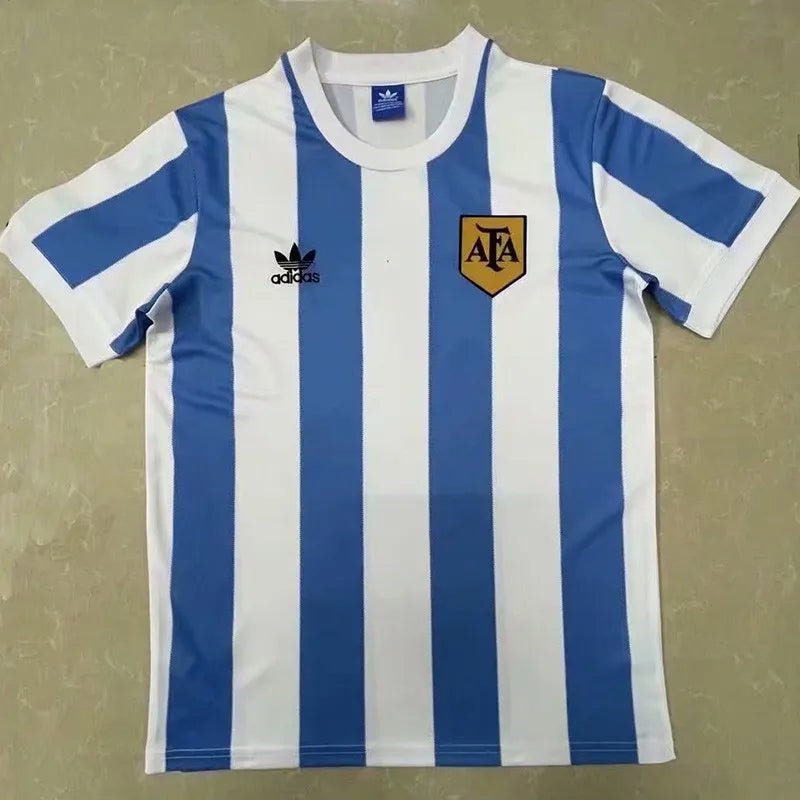 Camiseta retro Argentina 1978 primera equipación azul celeste campeón del mundo Kempes – Cortita y al Pie